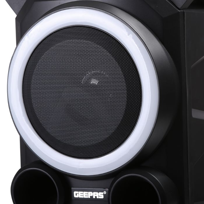 Geepas Portable Speaker 30000W PMPO -2600 MAh Rechargeable Battery, Powered With Bluetooth, Microphone & Cable, AM/FM Radio, Wheels & Easy Handle And USB Charging For Smartphones & Tablets